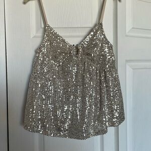 Tan colored top with silver sequence